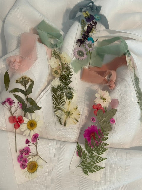 Bookmarks embellished with delicate dried flowers.